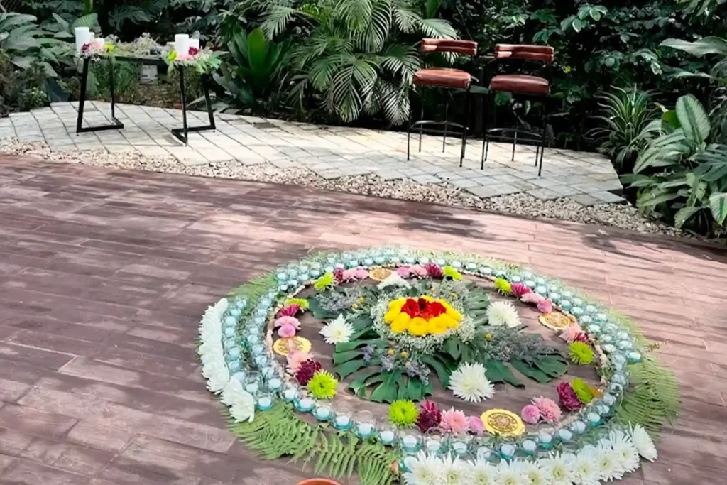 Holistic events in Medellín: a ceremonial circle featuring a mandala of colorful flowers in April, designed for wellness retreats.